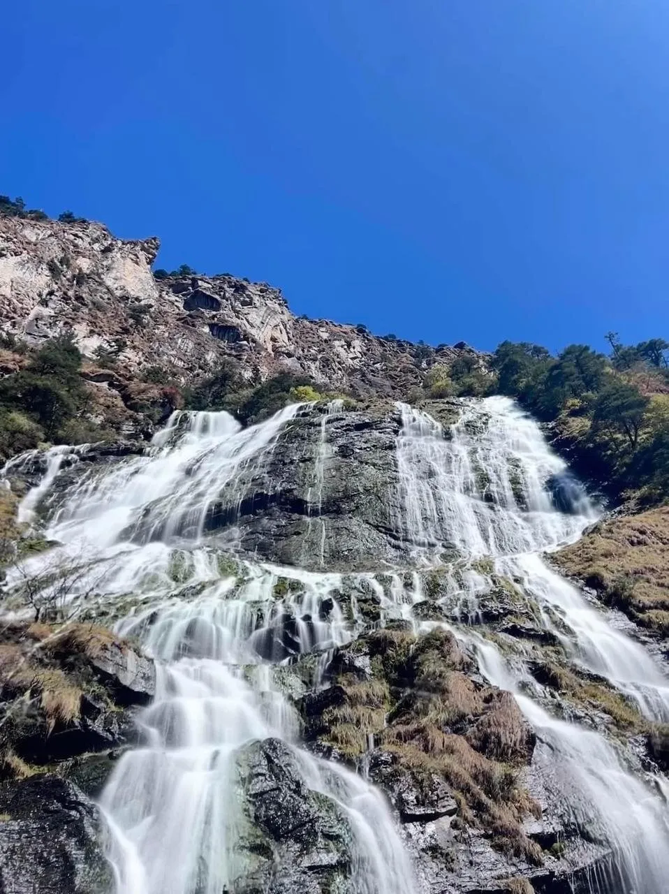 Mountain waterfall on a road journey near Tawang