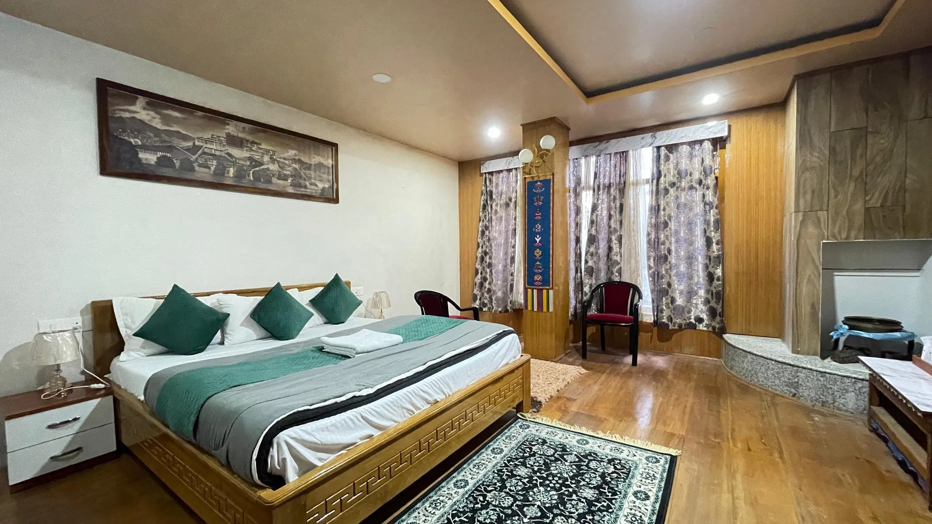 Wide Premium Room interior with a double bed and seating area