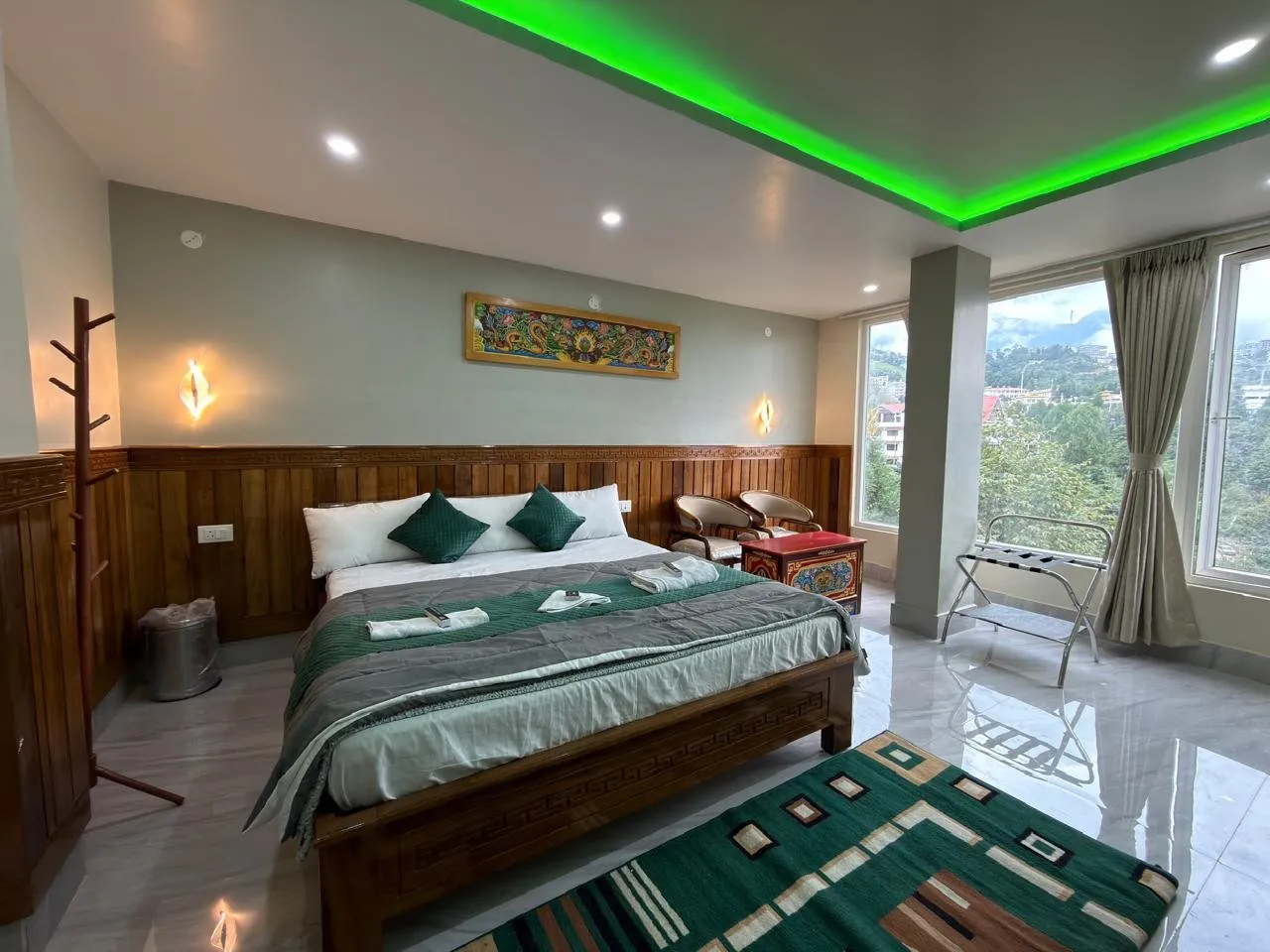 Presidential Suite at Rikya Retreat in Tawang with a double bed and large window view