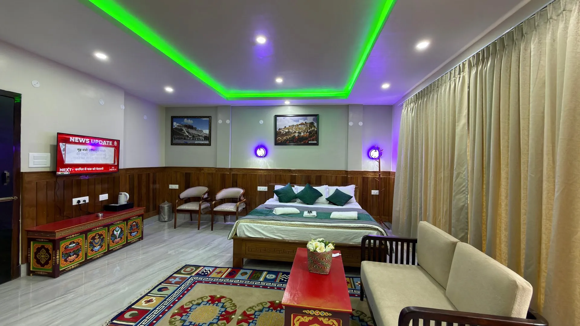 Wide interior of the Suite Room with a double bed and seating area