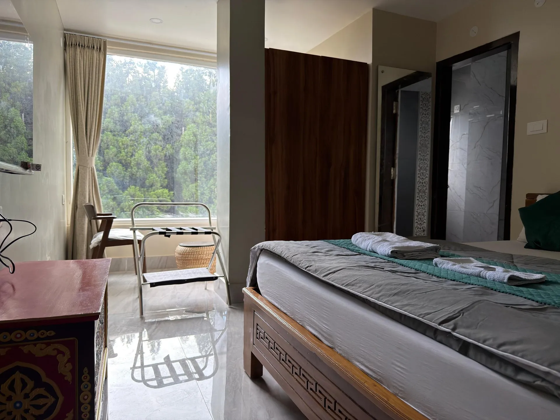 Super Deluxe Room with a double bed and large window view