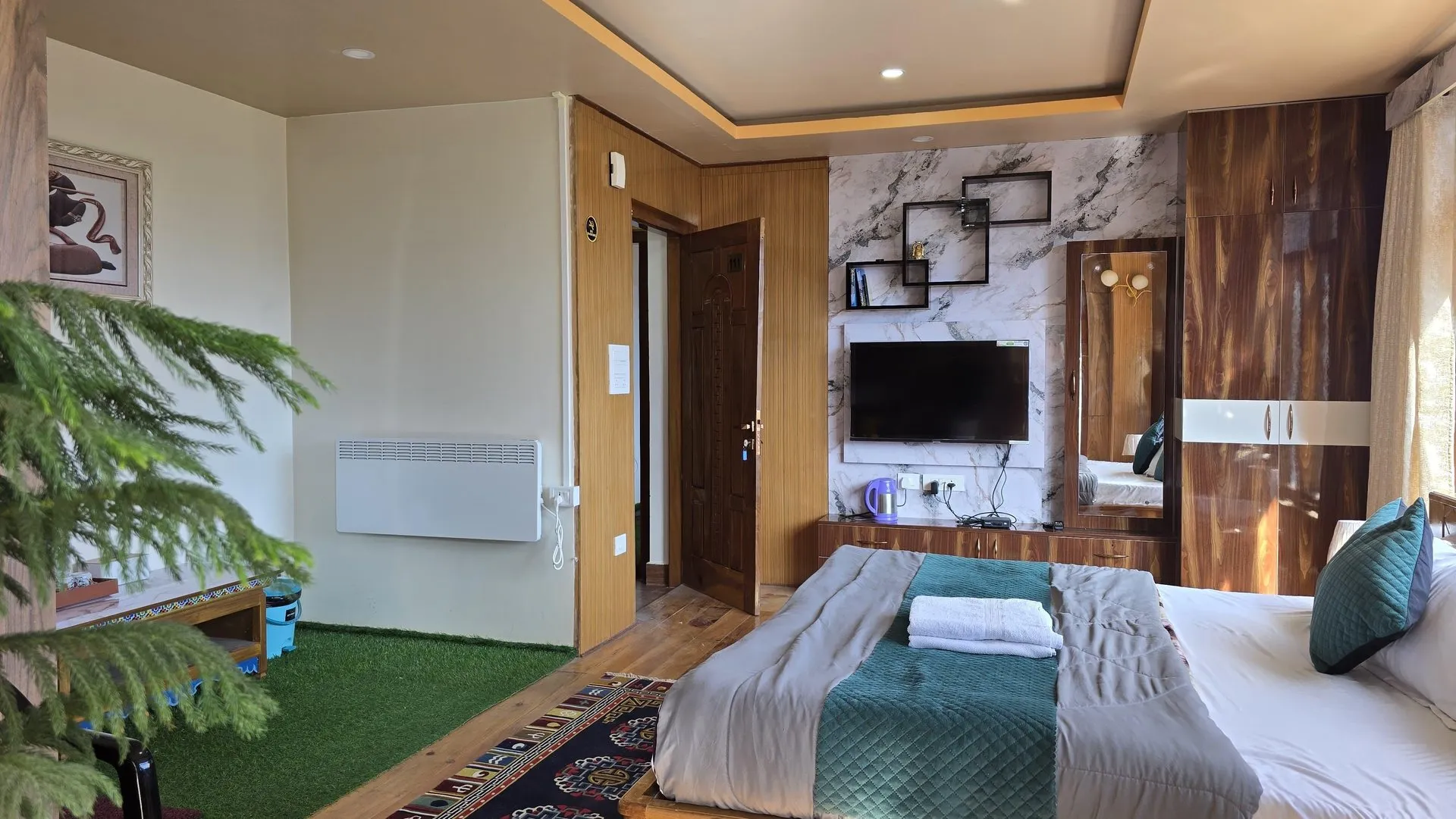 Super Premium Room showing the bed and television wall