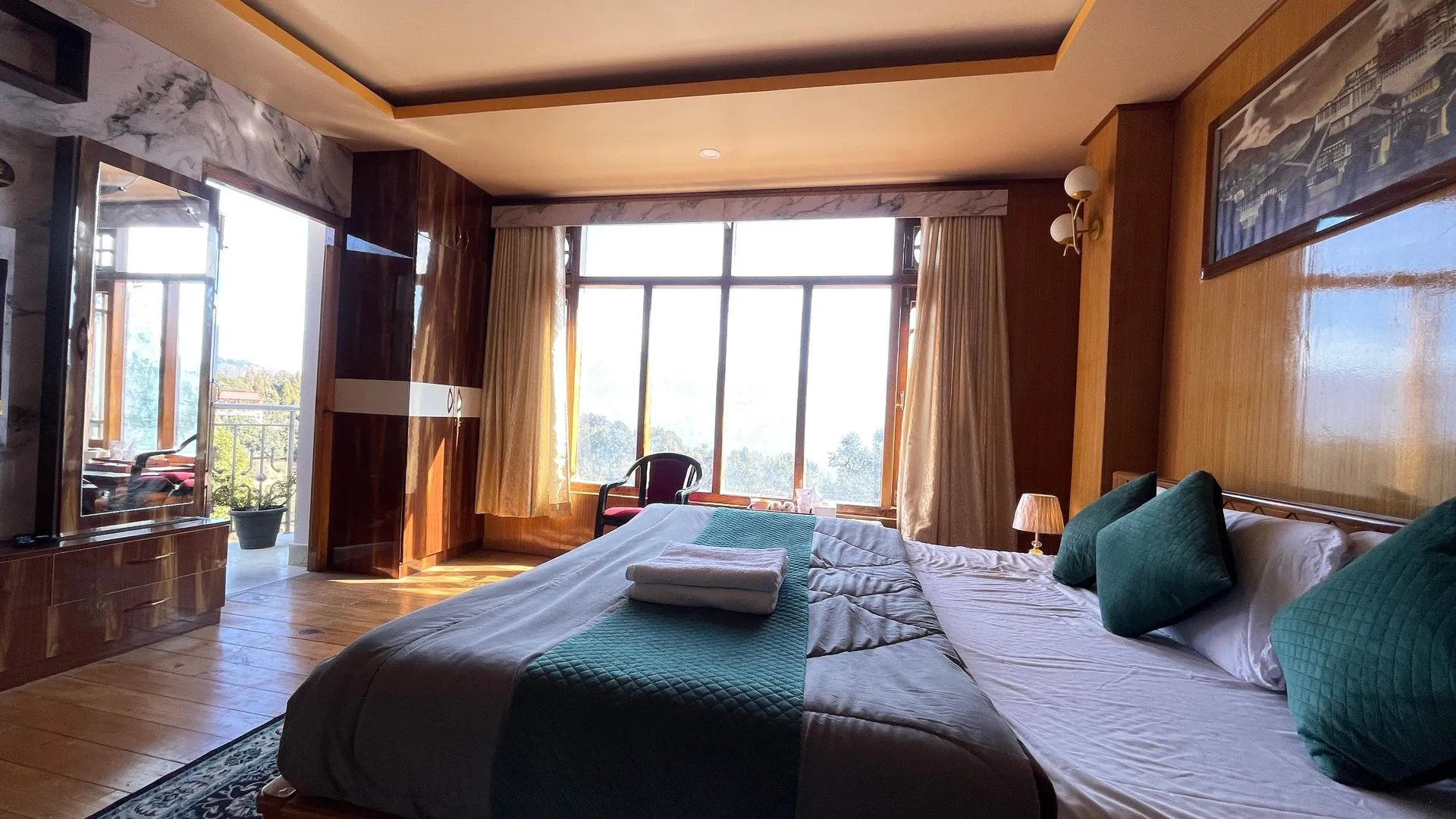 Super Premium Room with a large bed and scenic window view