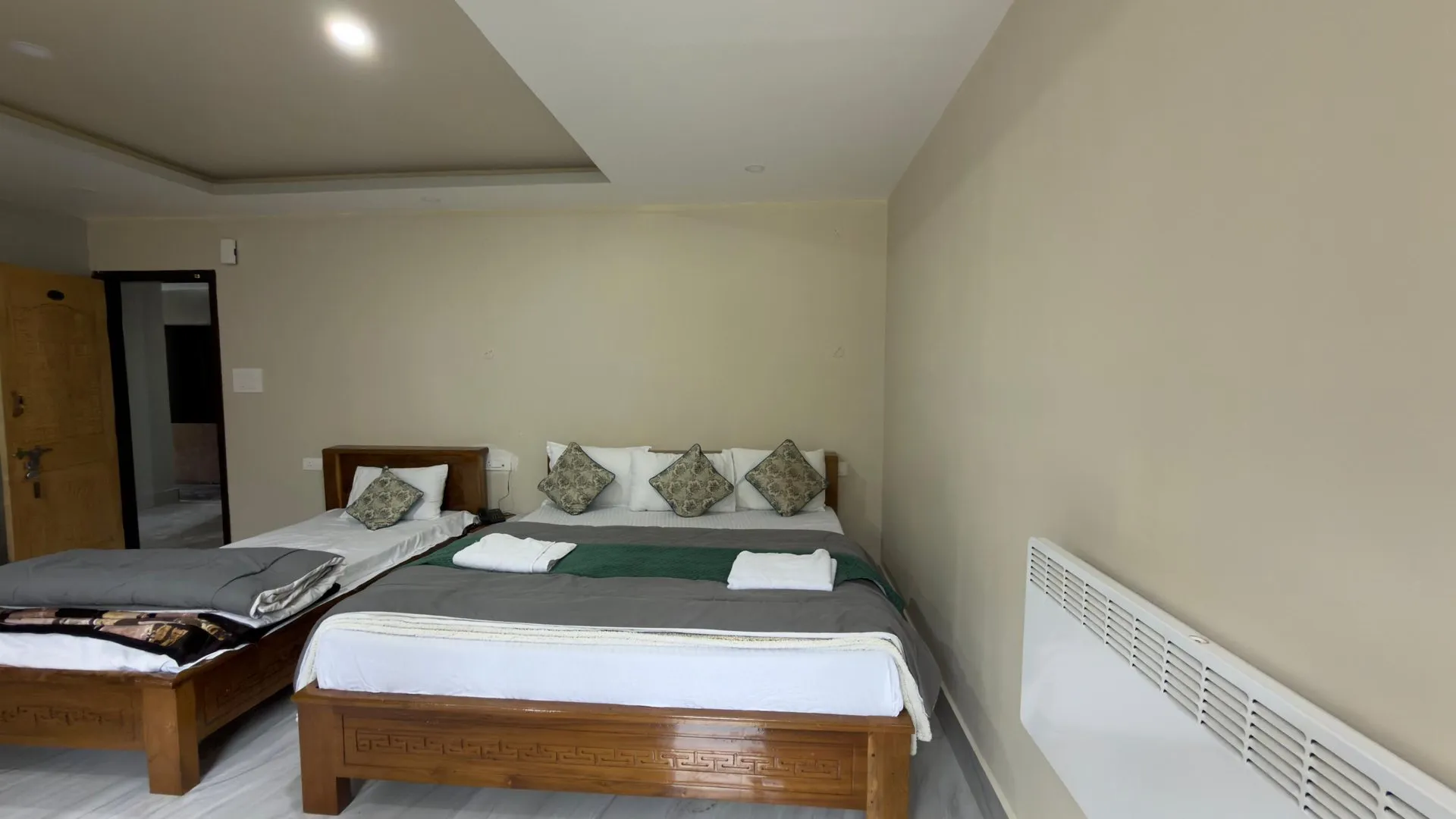 Alternate interior view of the Triple Bedded Room at Rikya Retreat