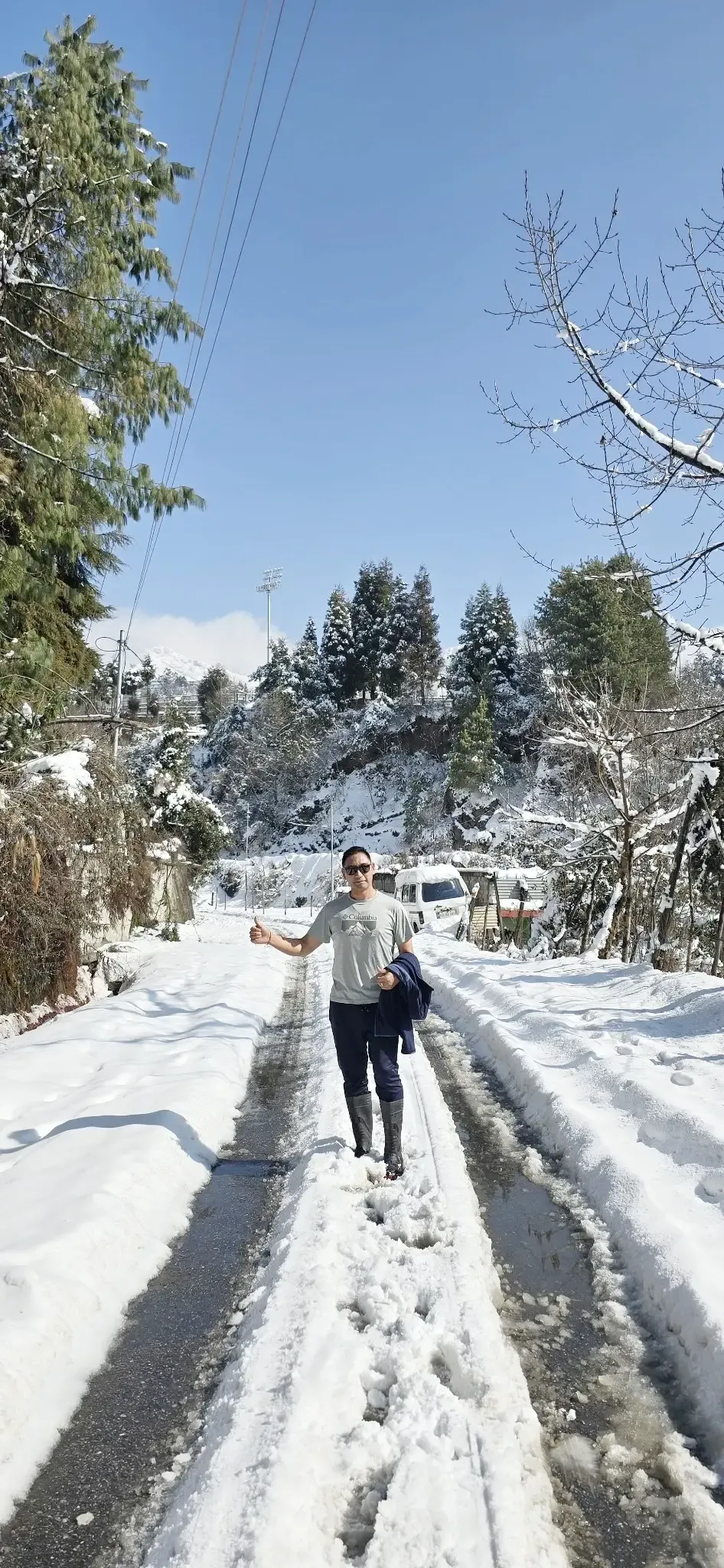 Snow-covered road and mountain landscape during winter in Tawang